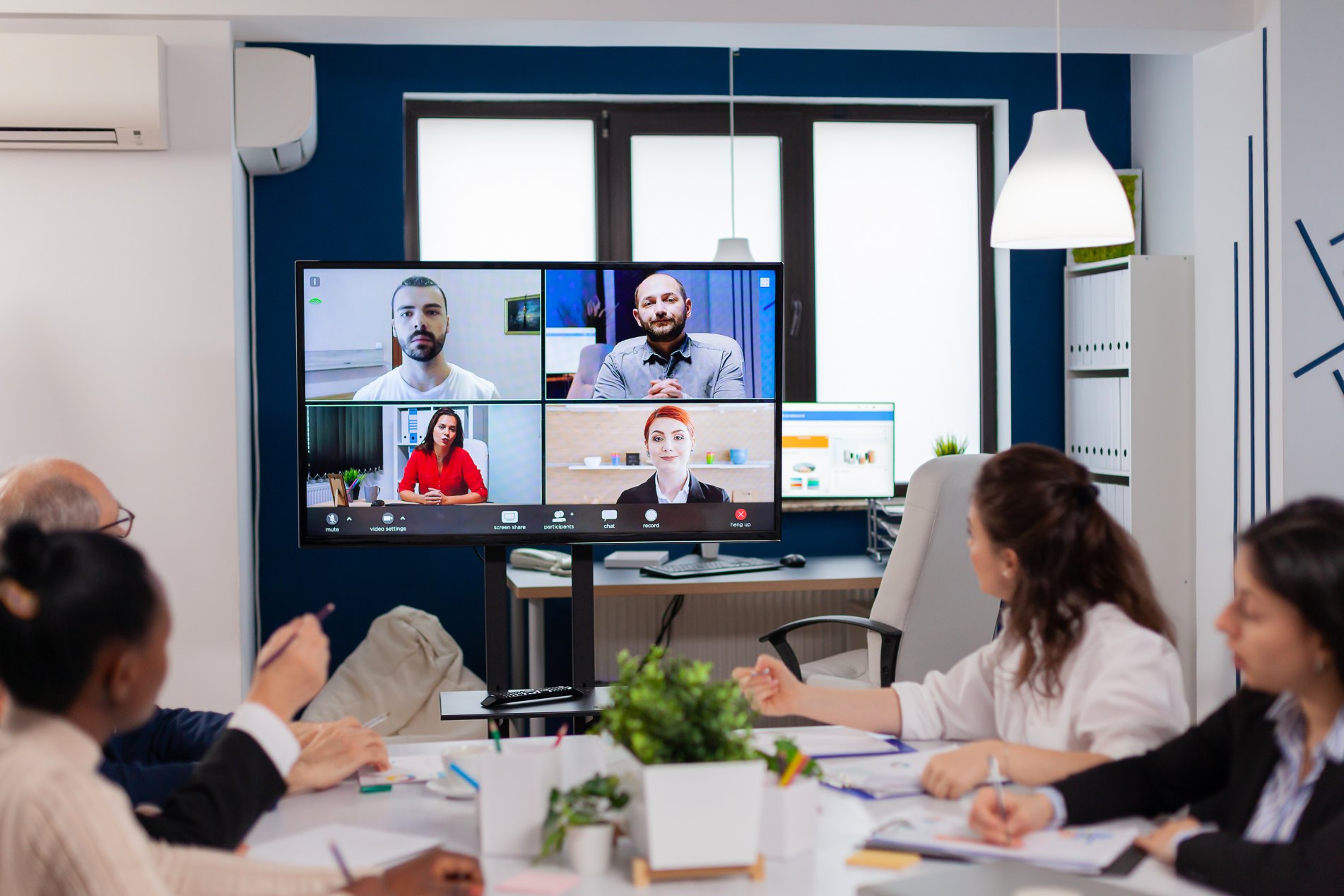 Hybrid video conference and in-person meeting